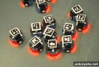 How Randomness Breaks Gridlock in Robot Swarms