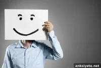 Why Familiar Faces Seem Happier Than Strangers