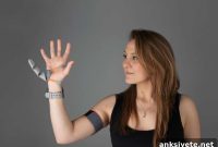 Wearing a Robotic Third Thumb Alters Brain Maps of the Hand