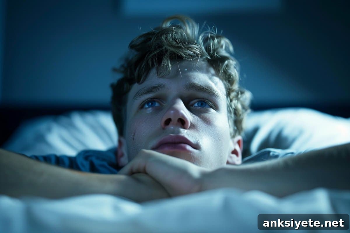 How Creatine Enhances Cognition During Sleep Deprivation 2 This shows a man laying awake in bed.