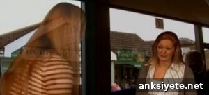 Still from the video showing a woman interacting with a computer-generated person.