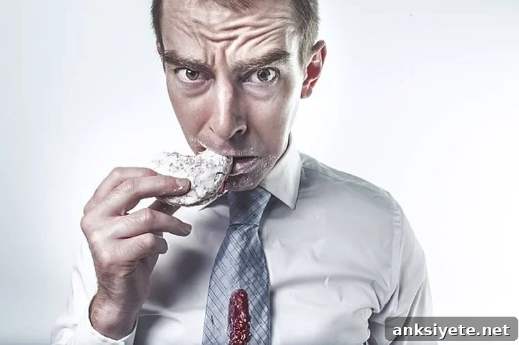 This shows a man looking guilty while eating a cookie.