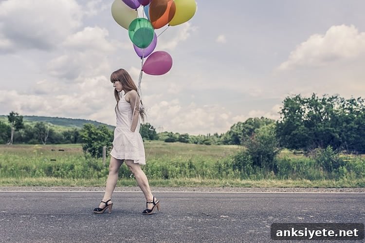 The image shows a girl walking. She is holding colorful balloons.