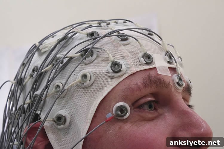 This shows a man in an EEG cap.