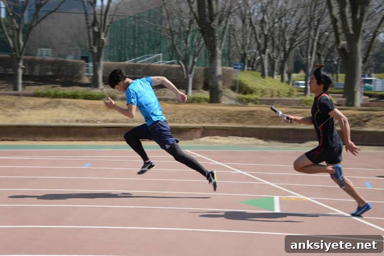 How Big Data Improves Running Performance 2 This image shows two people running a relay race.