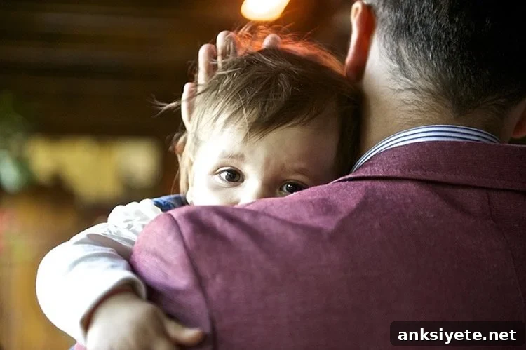 Photo shows a dad and baby.