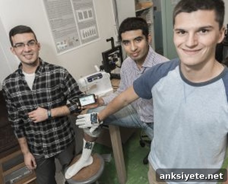 URI students and Professor Kunal Mankodiya displaying smart textile prototypes.