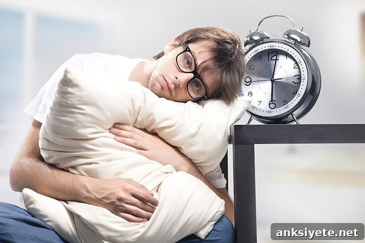 Image shows man sitting with a pillow.