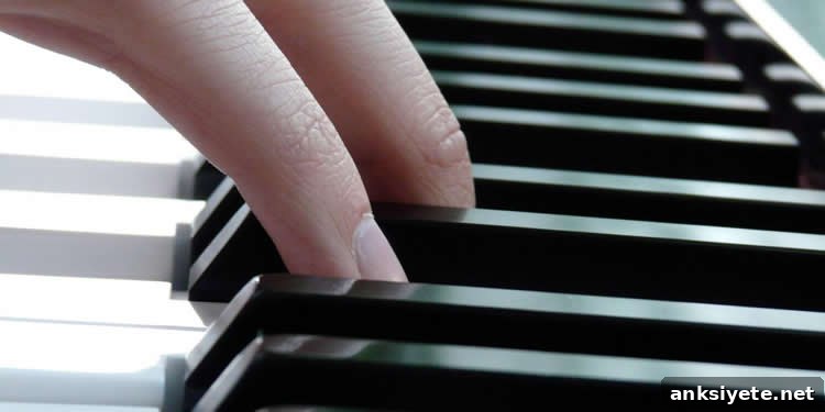 Image shows a person playing piano.