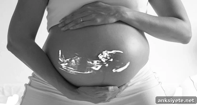 Pregnant belly with an ultrasound image of a fetus