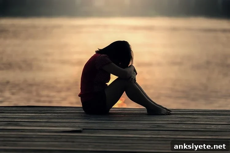 Image shows a depressed looking young girl.