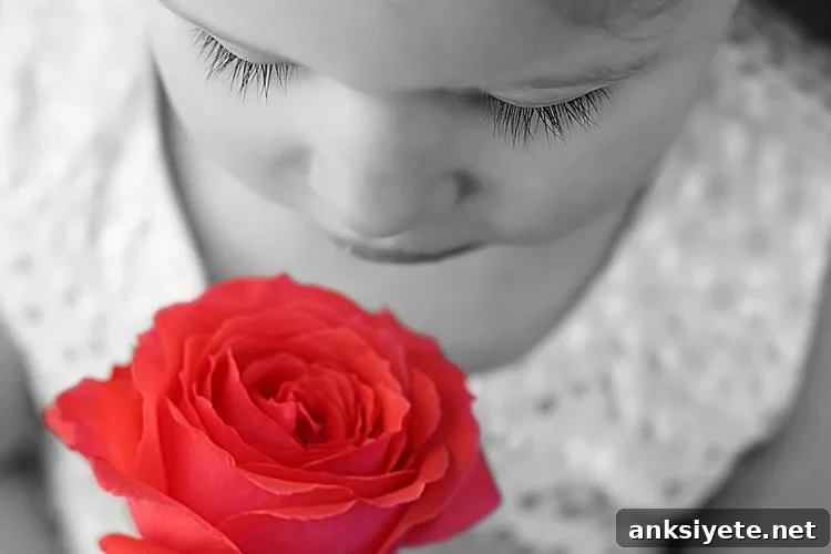 New Study Reveals How the Brain Processes Smells 2 Image shows a girl sniffing a rose.