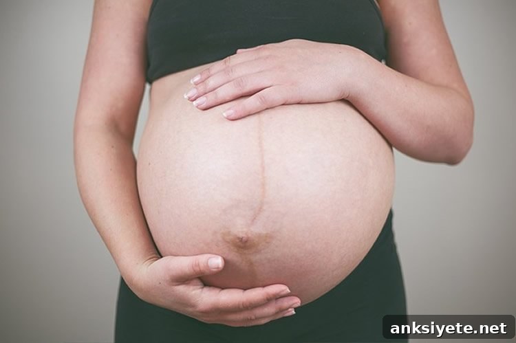 Image shows a pregnant woman.