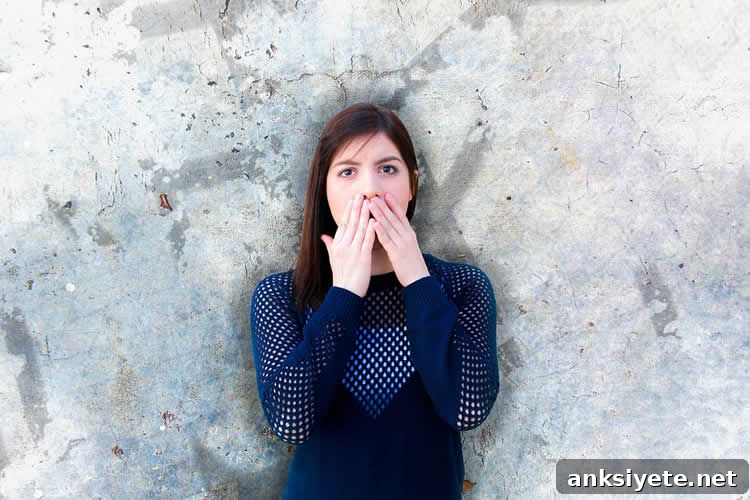 Woman covering her mouth