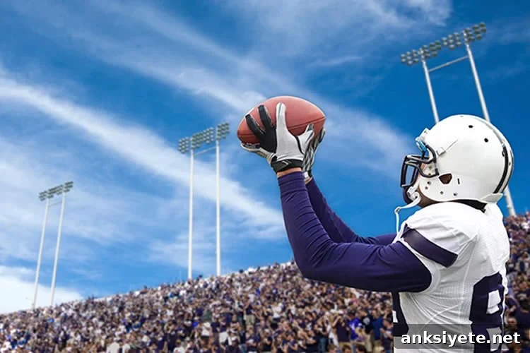 Football player catching the ball