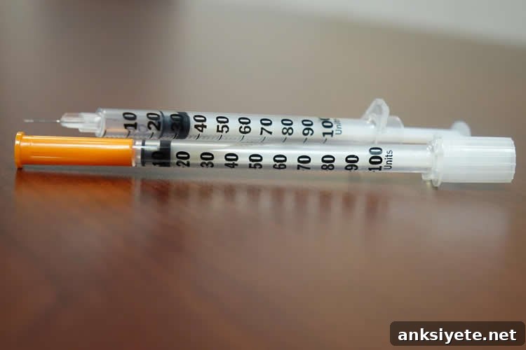 Image shows a syringe.