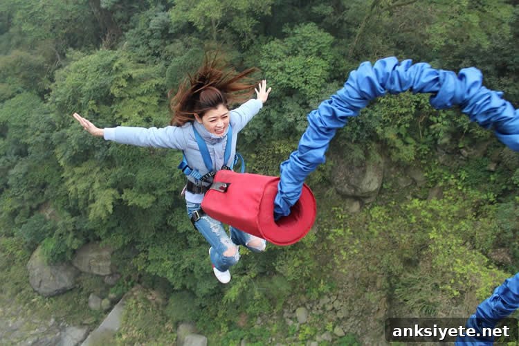 Image shows a woman bungee jumping.