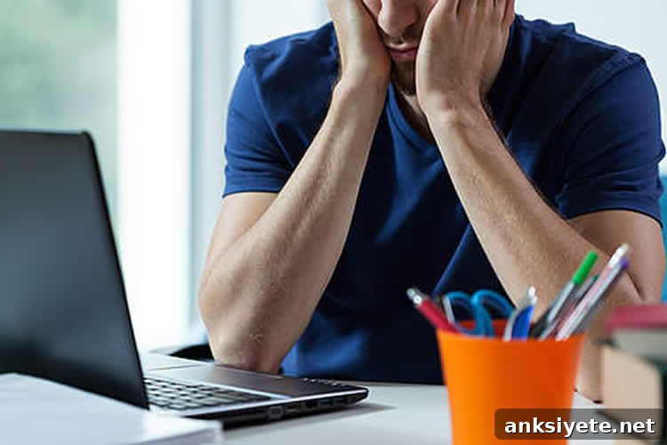 a stressed man sitting at a desk