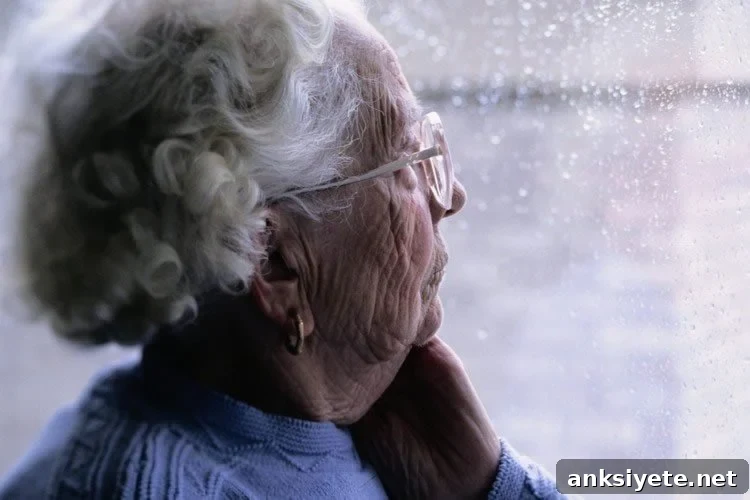 an elderly person looking out of a window