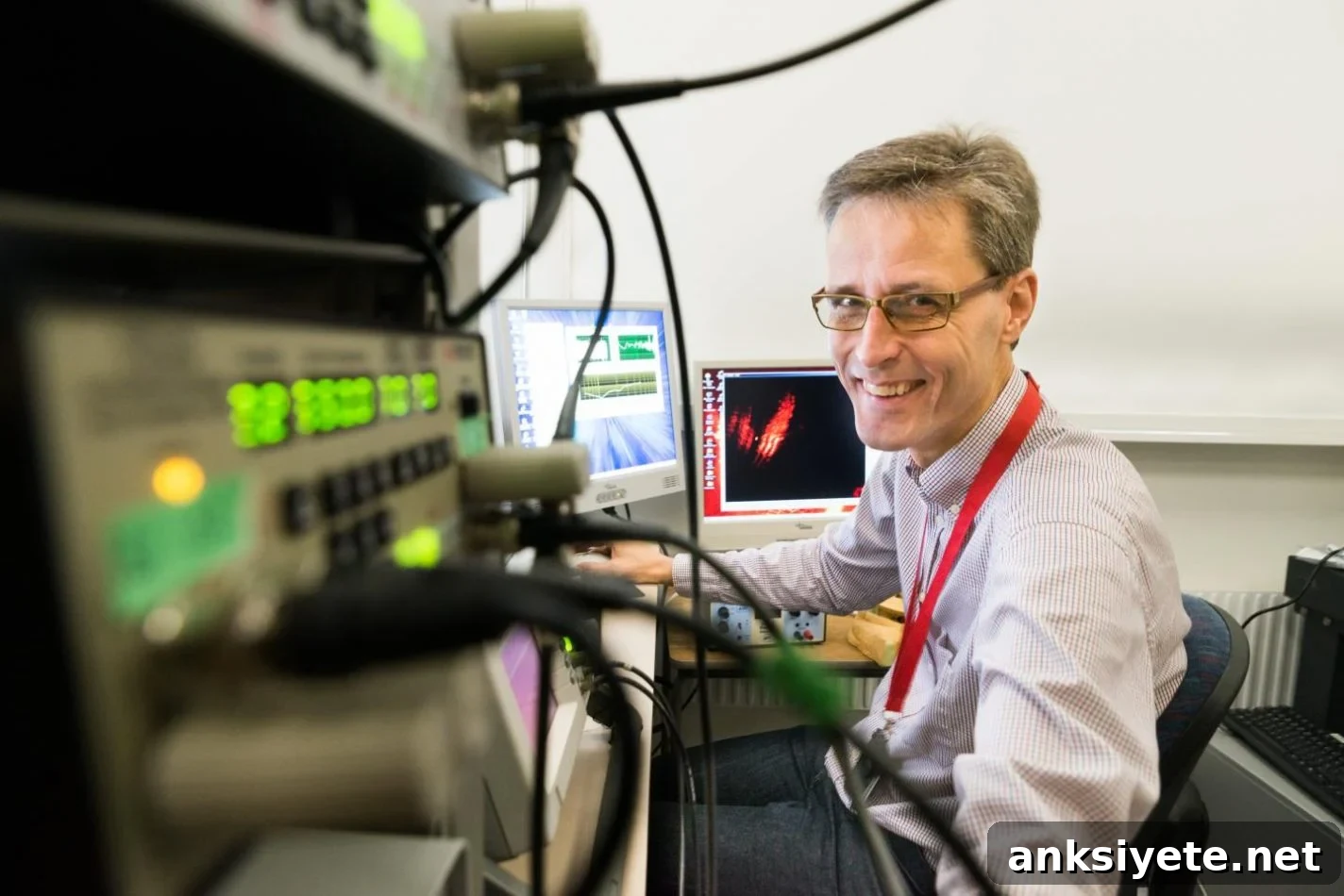 Anders Fridberger is shown sitting at his desk.