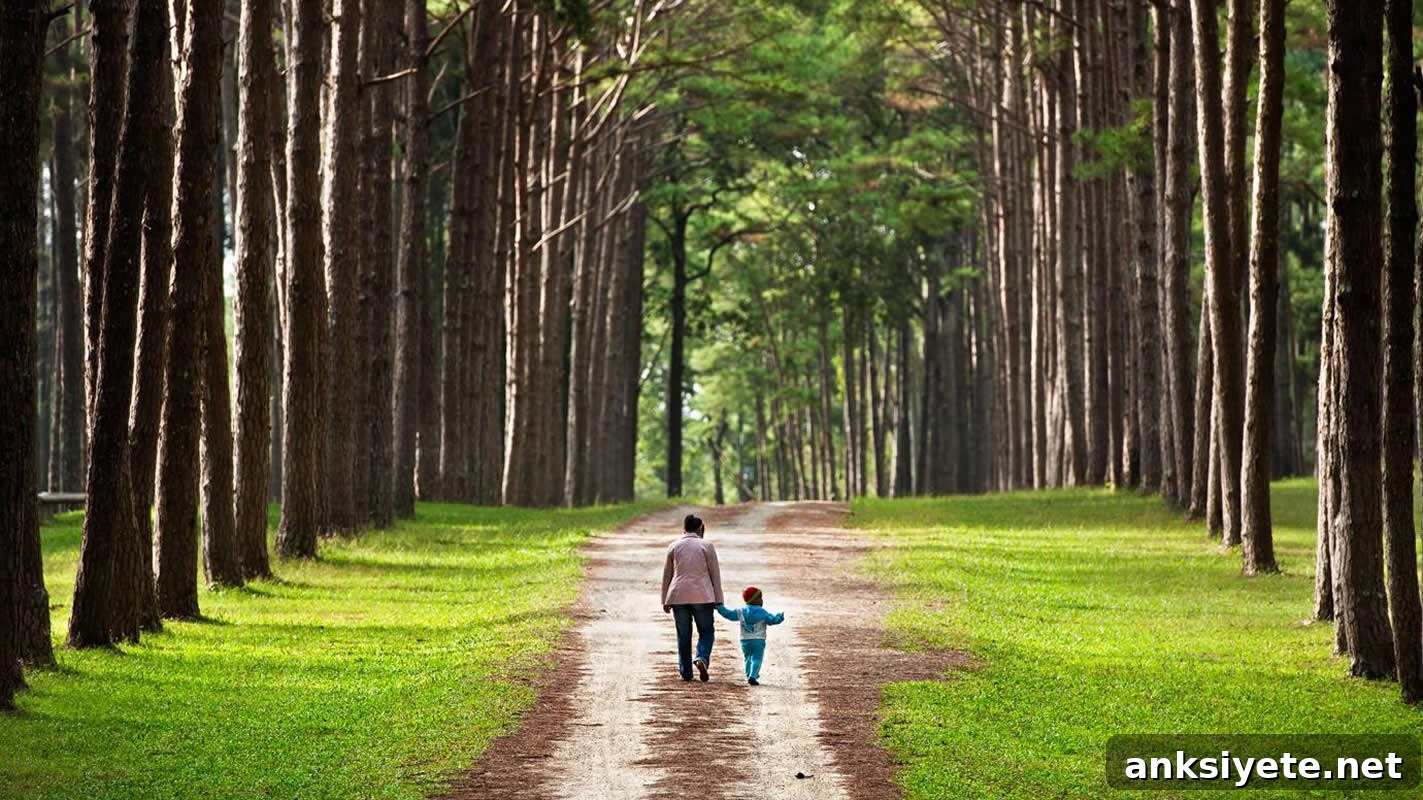 This shows a parent and child walking in the park
