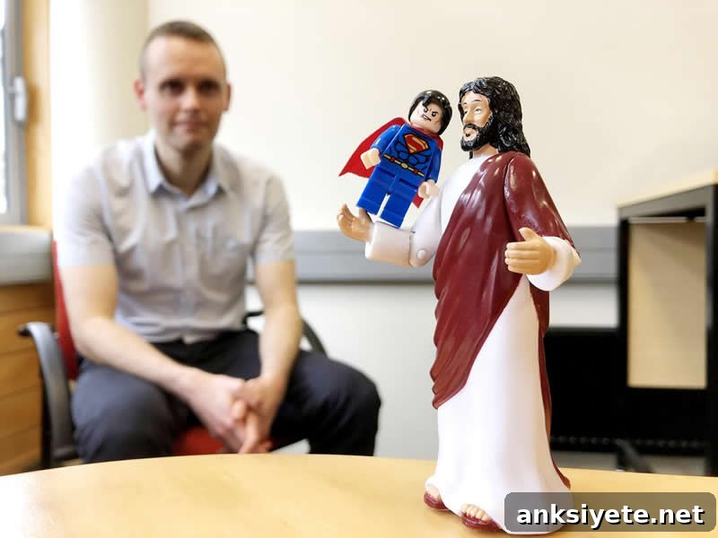 This shows a statue of jesus holding up a lego superman