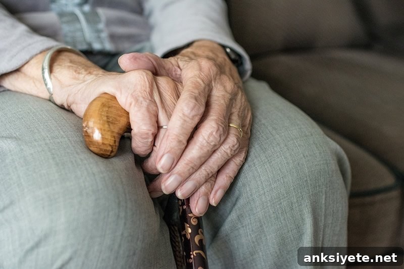 An older woman with a walking stick