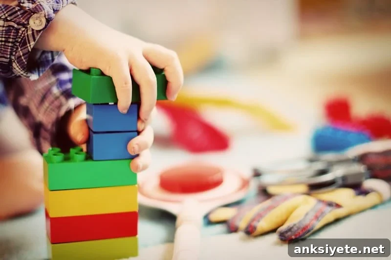 Why Are Children Less Affected by COVID-19? 2 This shows a child playing with blocks