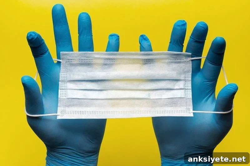 This shows gloved hands and a face mask