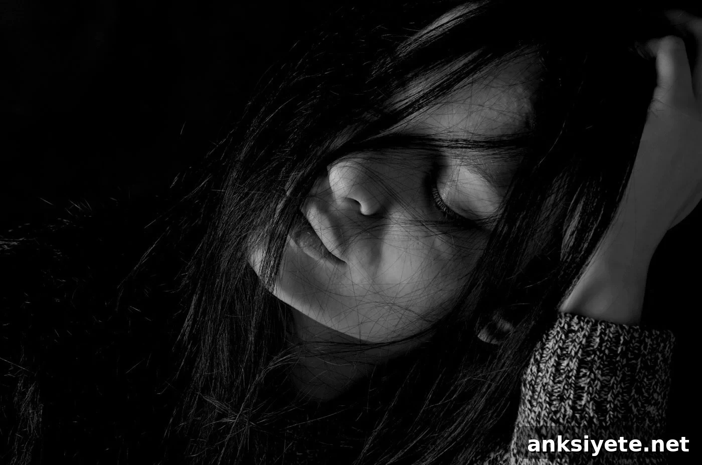 This shows a depressed woman