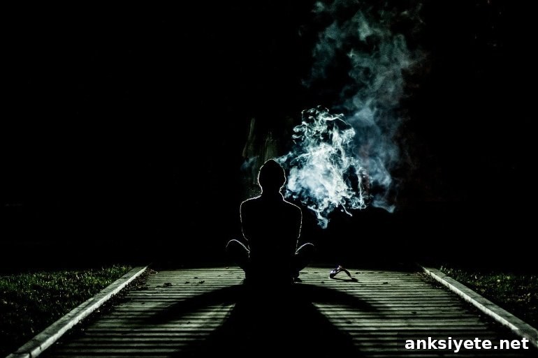 This shows a young person surrounded by smoke