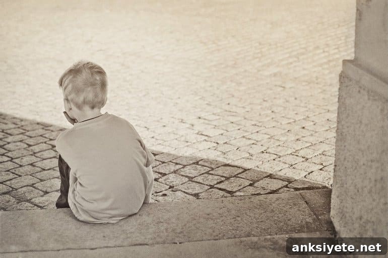 Genetic Links Between ADHD and Aggressive Behavior 2 A young boy sitting on outdoor steps