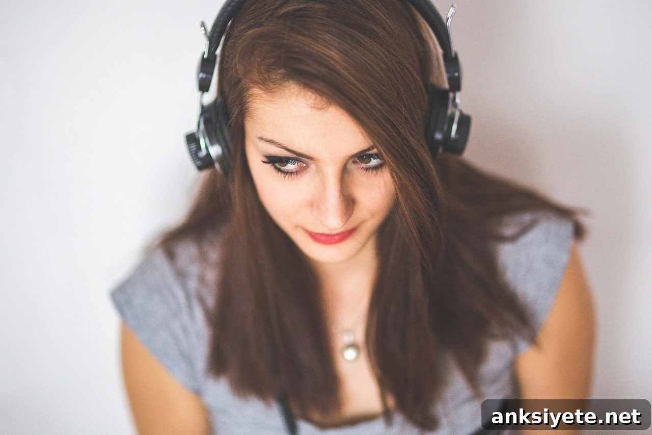 This shows a woman with headphones on