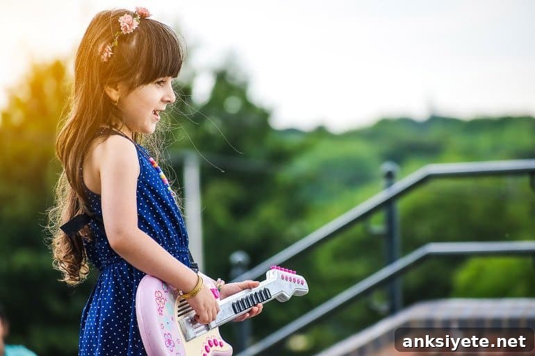 This shows a little girl singing and playing a toy guitar