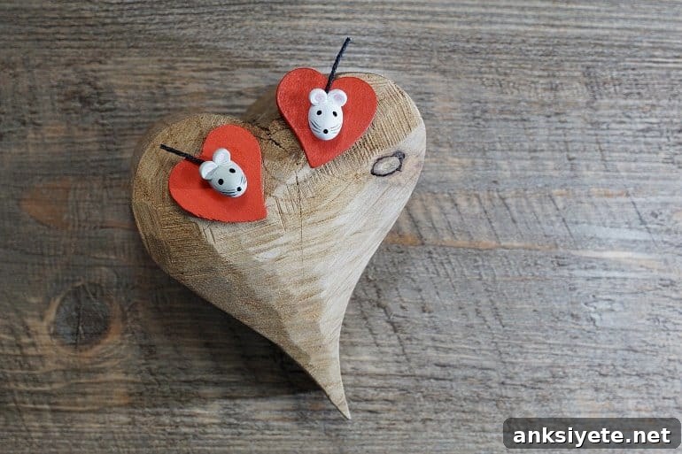 Mother Mice Use Oxytocin to Teach Parenting to Other Females 2 This shows two mouse toys on a wooden heart