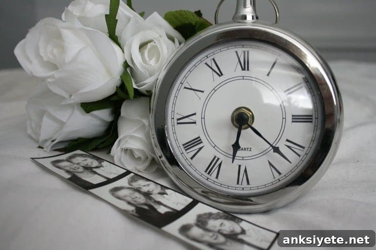 This shows some photographs, an alarm clock and white roses