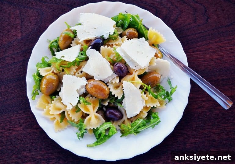 This shows a pasta salad with olives and feta cheese