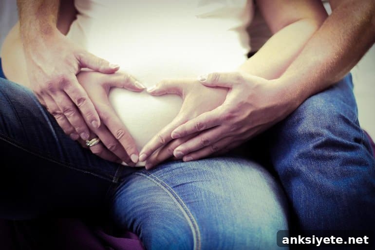 Delivery Method Doesn't Impact Postpartum Sexual Satisfaction 2 This shows a pregnant woman being hugged by her partner