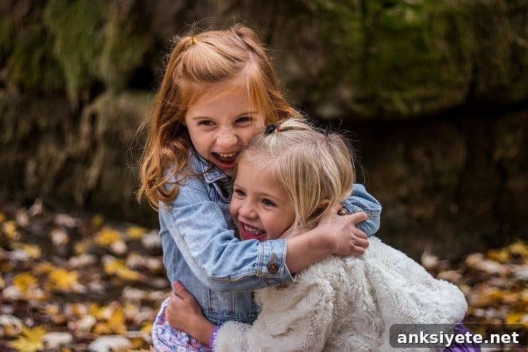 This shows two little girls hugging