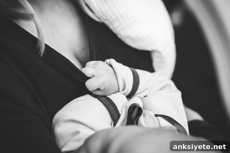 This shows a mom breastfeeding her baby